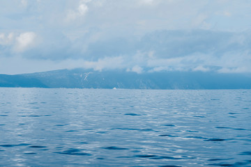 Fototapeta na wymiar Picturesque Adriatic sea landscape with rocky shores, Horatia, blue colors background