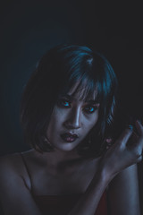 Woman with makeup in dark tone image