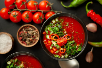 Traditional spanish cold tomato soup gazpacho on concrete background