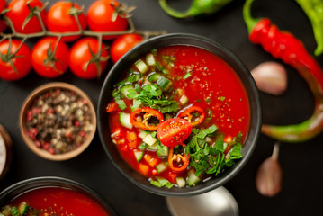 Traditional spanish cold tomato soup gazpacho on concrete background