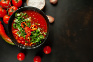 Traditional spanish cold tomato soup gazpacho on concrete background