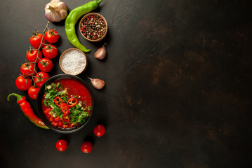 Traditional spanish cold tomato soup gazpacho on concrete background