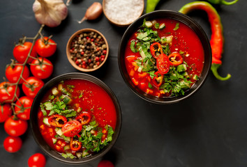Traditional spanish cold tomato soup gazpacho on concrete background