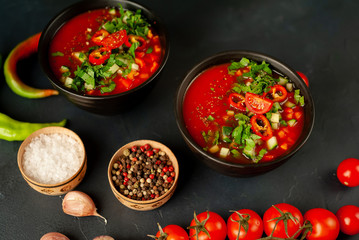Traditional spanish cold tomato soup gazpacho on concrete background