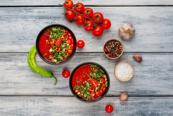 Traditional spanish cold tomato soup gazpacho on wood background