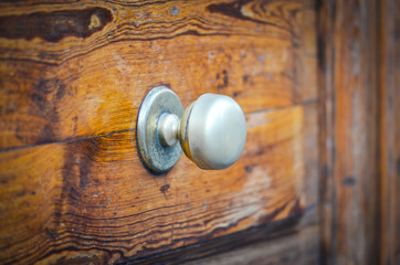 old ancient doors from wood and designed knobs