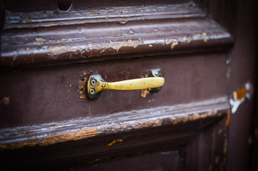old ancient doors from wood and designed knobs