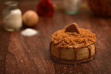 cake sweet pastry dessert with icing on wooden background. Rustic style and natural light