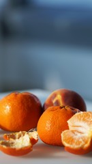 Close up view on whole mandarines and slices and peel