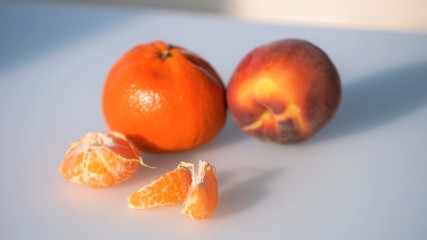 Close up view on whole mandarines and slices and peel