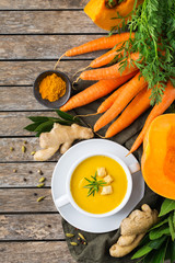 Seasonal spicy fall autumn creamy pumpkin and carrot soup