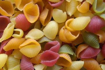 Colorful uncooked pasta close up