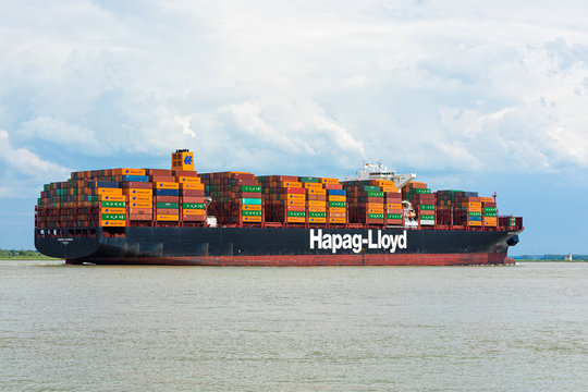 Stade, Germany &ndash; June 14, 2019: Container ship SANTOS EXPRESS, operated by Hapag-Lloyd, on Elbe river heading towards Hamburg.