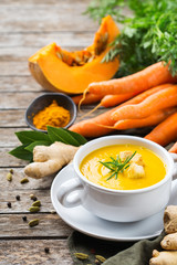 Seasonal spicy fall autumn creamy pumpkin and carrot soup