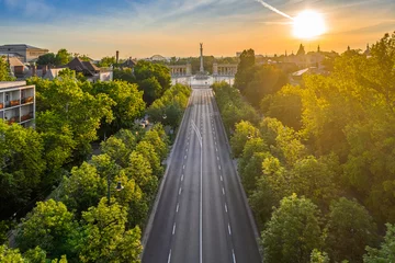 Tableaux ronds sur aluminium brossé Budapest Budapest, Hungary - Aerial drone view of Andrassy street at sunrise with Heroes' Square (Hosok tere) at background at summer time