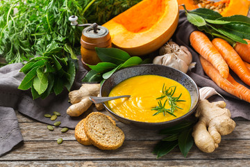 Seasonal spicy fall autumn creamy pumpkin and carrot soup