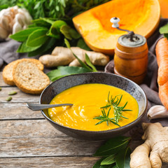 Seasonal spicy fall autumn creamy pumpkin and carrot soup