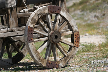 Fototapeta na wymiar Vintage wooden Horse Carriage wheel