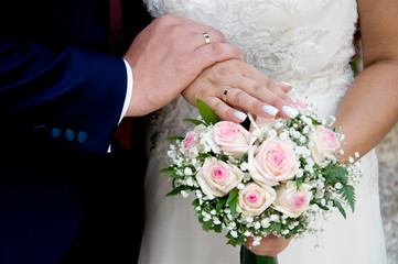 Obraz na płótnie Canvas wedding photo of a bouquet with a bride and groom
