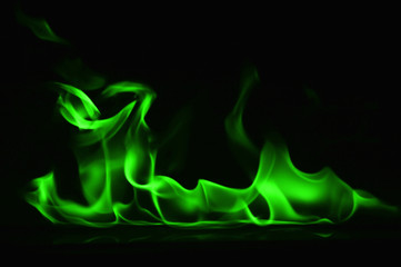 Beautiful fire green flames on a black background.