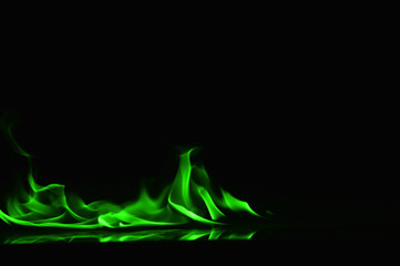 Beautiful fire green flames on a black background.