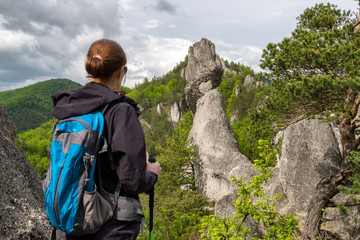 Hiker woman looking at Sulov rocks, Slovakia