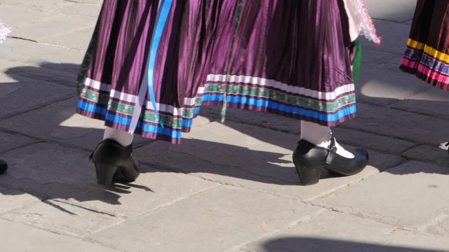 Close up of ballet folklorico shoes dancing in Typical celebration in Corfu festival. Traditional Costumes of Hellenic culture. Mediterranean folkore dance with mid cuban heels.
