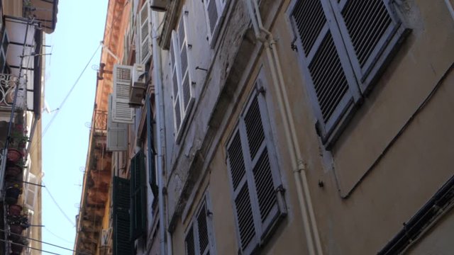 From Down to Up Shot Apartment Builidings in Alley . Old quarter with beautiful facede in European Street with palace in characteristic neighborhood with small balcony.