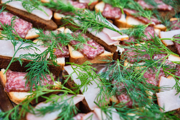 Small sandwiches. Sandwiches on skewers. Catering. Banquet