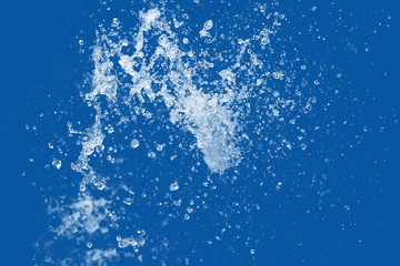 Water Splash on blue background.