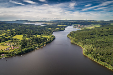 The Lipno Reservoir  is a dam and hydroelectric plant constructed along the Vltava River in the Czech Republic. This area is mountainous, and borders the Sumava National Park and Nature Reserve