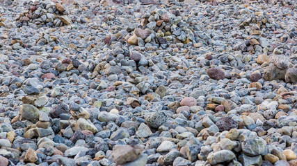 Texture of colored pebble stones at beach on Iceland