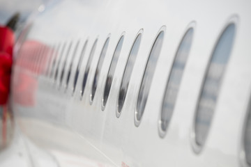 Windows of airplane with emergency sign. airplane portholes