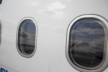Windows of airplane with emergency sign. airplane portholes