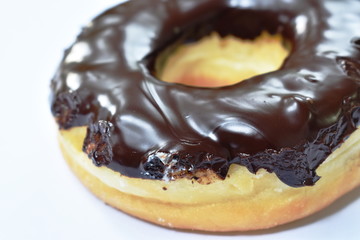 chocolate cream donuts on white background