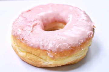 strawberry cream donuts on white background