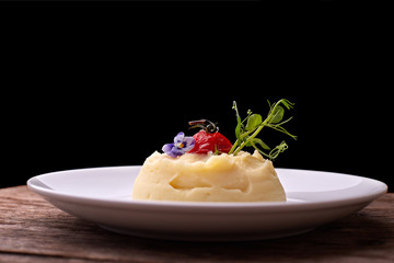 Mashed potatoes on a white plate