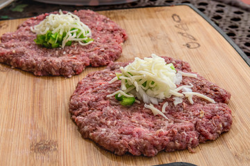 Fresh Beef Patties on a Bamboo Coating Board