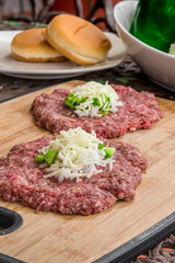 Fresh Beef Patties on a Bamboo Coating Board 