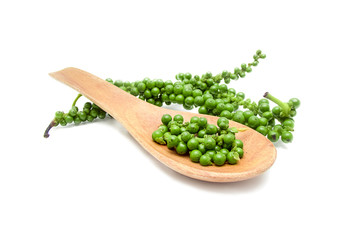 Fresh green peppercorns on white background