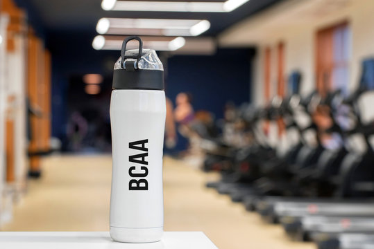 Plastic Bottle Or Cup With Branched-chain Amino Acid Drink Close Up