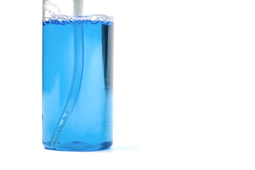 tooth rinse in bottle on white isolated background