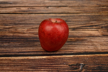 Ripe red Apple on wooden table background