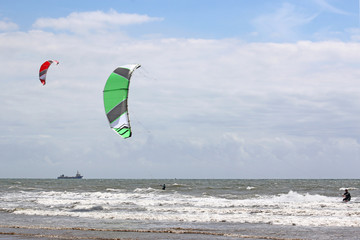 kitesurfers riding the waves