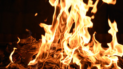 Fire with yellow and orange flames on black background