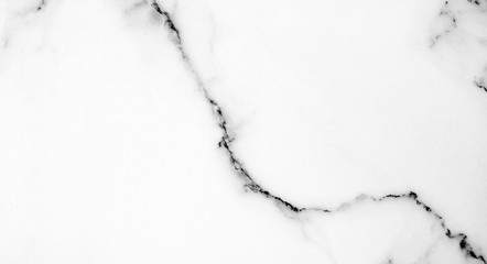 White marble pattern with curly grey and black veins. Abstract texture and background