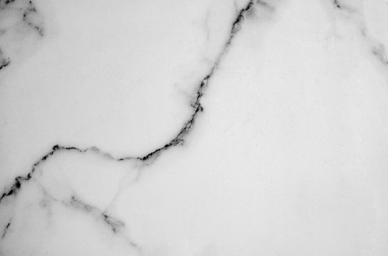 White marble pattern with curly grey and black veins. Abstract texture and background © Alisa