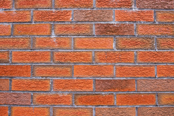 Worn orange brick wall surface texture background