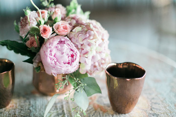 pink peonies and roses in vase, wedding table arrangement, rose gold candle holder, reception decorations