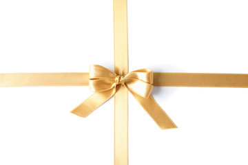 Golden ribbon with bow isolated on white background. Gift concept